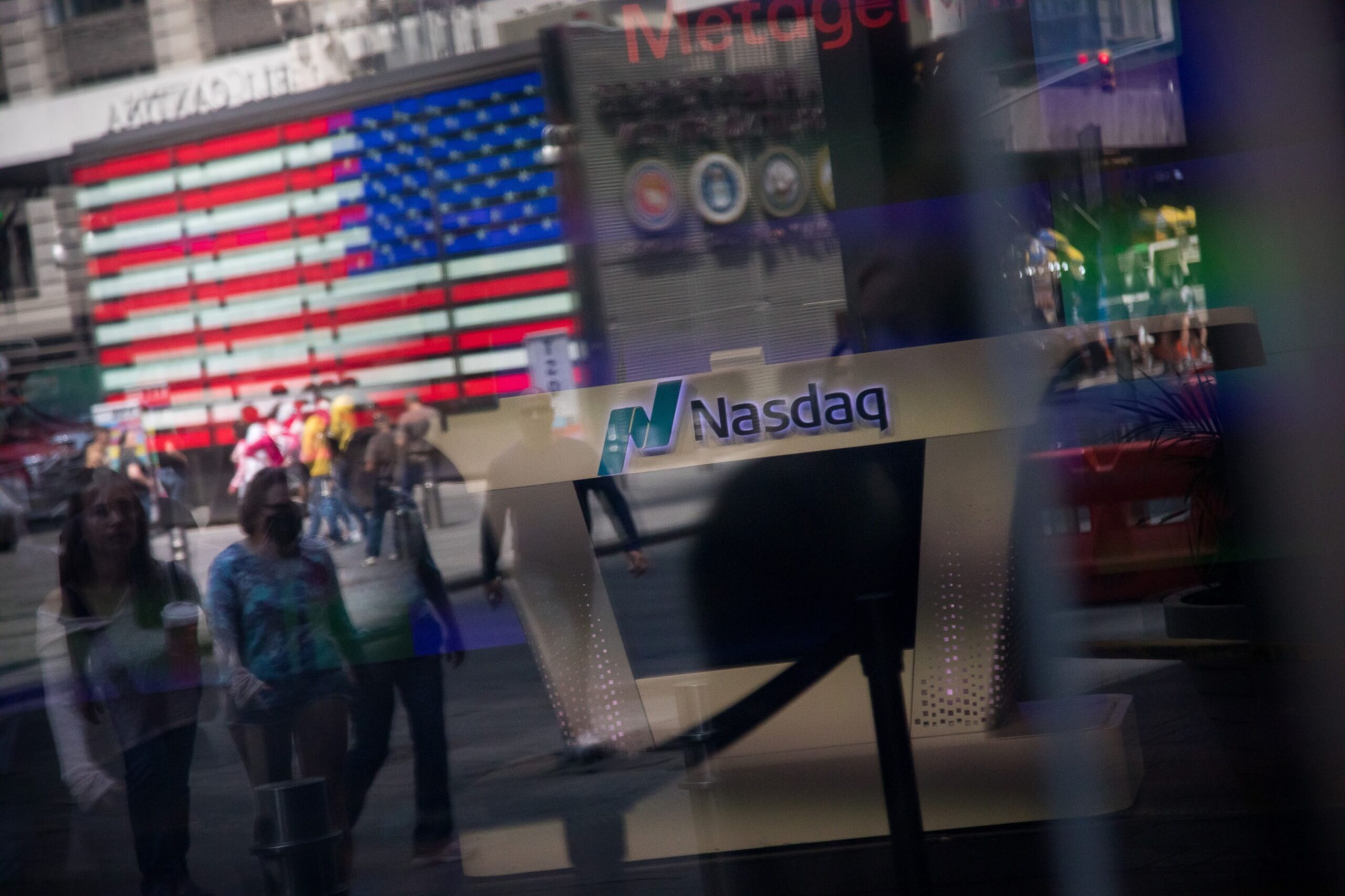 Times Square is reflected in the window of the Nasdaq MarketSite in New York, US, on Friday, June 9, 2023. Technology shares continued to rise today, pushing the S&P 500 further into bull-market territory as the dollar headed for its biggest weekly loss in two months on bets the Federal Reserve is nearing the end of its hiking cycle. Photographer: Michael Nagle/Bloomberg